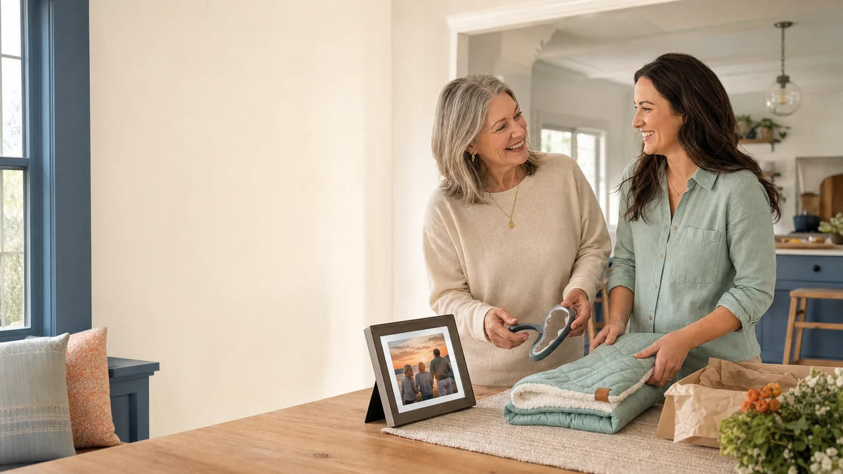 Mother and adult daughter sharing thoughtful gifts in a warm kitchen